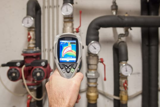 Plumber using a thermal imaging camera to inspect pipes in Chula Vista