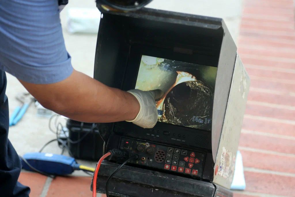 Technician viewing a drain inspection camera in Chula Vista
